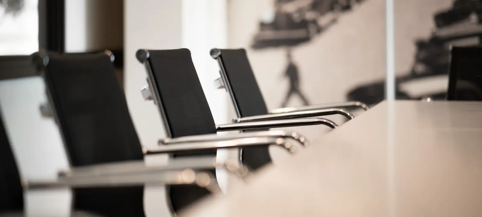 Empty boardroom chairs before a meeting